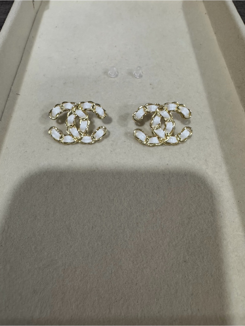 White & gold stud earrings